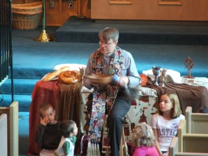 The Reverend Brinn delivers a sermon to children